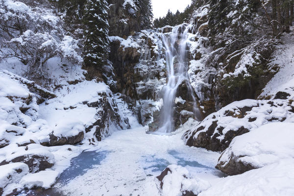 Vo' waterfall near Schilpario iced in winter. Val di Scalve, Bergamo province, Lombardy, Italy.
