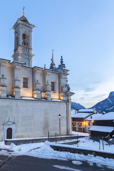 View of the church of Vilminore during a winter sunset. Vilminore, Val di Scalve, Bergamo district, Lombardy, Italy.