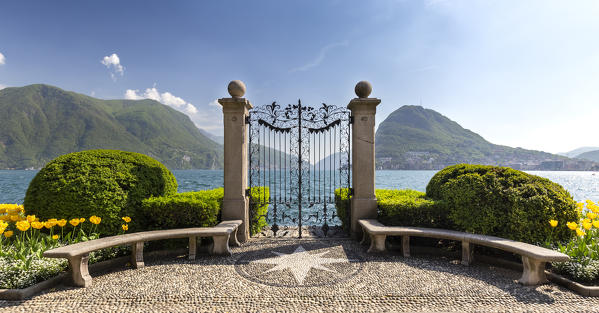 View of the old gates of Parco Ciani in Lugano city on a spring day, Canton Ticino, Switzerland.