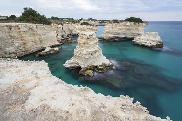 The Faraglioni of Torre Sant'Andrea. Melendugno, province of Lecce, Salento, Apulia, Italy.
