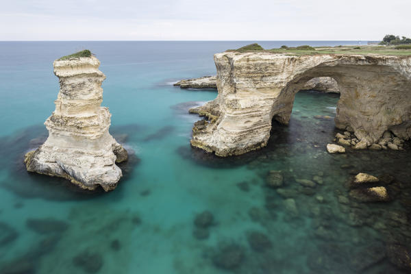 The Faraglioni of Torre Sant'Andrea. Melendugno, province of Lecce, Salento, Apulia, Italy.