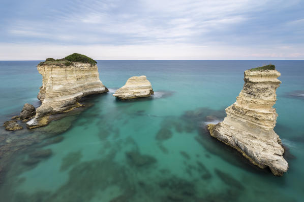 The Faraglioni of Torre Sant'Andrea. Melendugno, province of Lecce, Salento, Apulia, Italy.