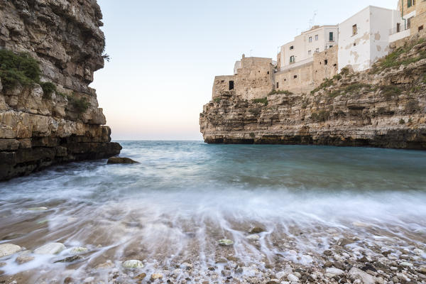 Waves on the beach of the Lama Monachile Cala Porto's cove in Polignano a Mare. Bari district, Apulia, Italy, Europe.