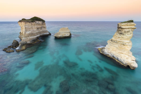 The Faraglioni of Torre Sant'Andrea. Melendugno, province of Lecce, Salento, Apulia, Italy.