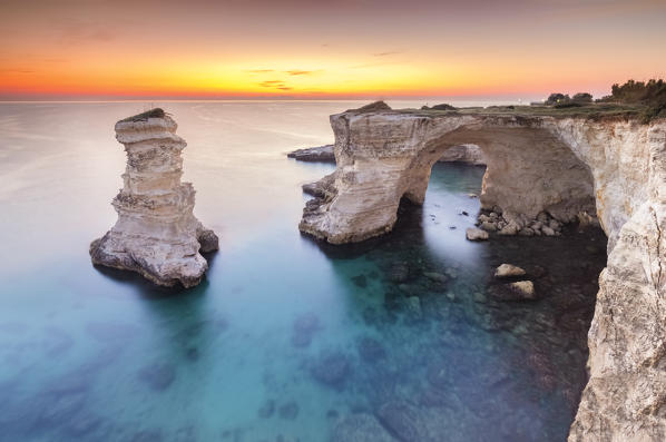 The Faraglioni of Torre Sant'Andrea at sunrise. Melendugno, province of Lecce, Salento, Apulia, Italy.