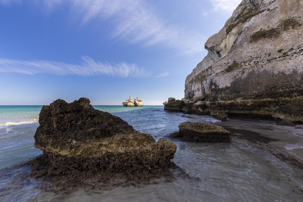 The Two Sisters stacks in front of the shore of Torre dell'Orso. Melendugno, province of Lecce, Salento, Apulia, Italy.