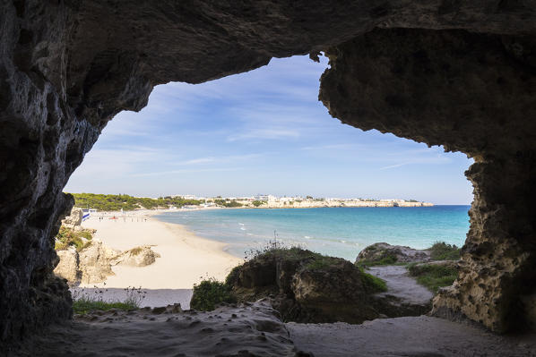 View of the beach of Torre dell'Orso from a cave in the homonym beach. Melendugno, province of Lecce, Salento, Apulia, Italy.