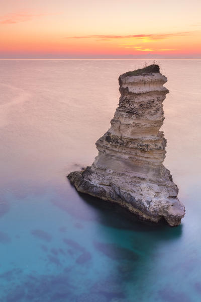 The Faraglioni of Torre Sant'Andrea at sunrise. Melendugno, province of Lecce, Salento, Apulia, Italy.