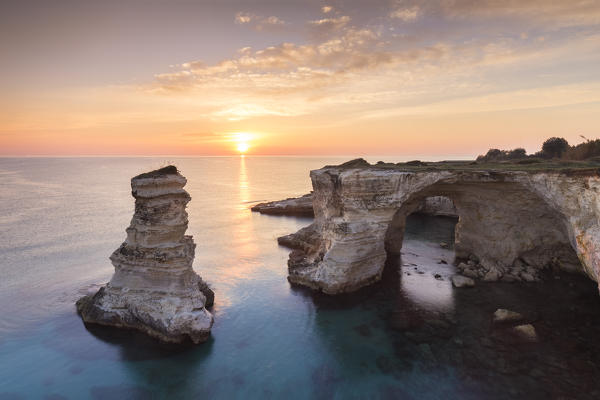 The Faraglioni of Torre Sant'Andrea at sunrise. Melendugno, province of Lecce, Salento, Apulia, Italy.