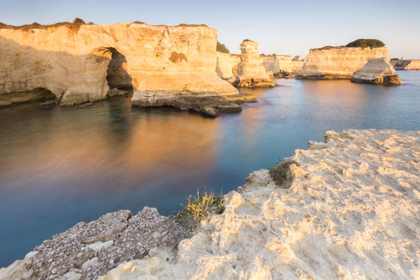 The Faraglioni of Torre Sant'Andrea at sunrise. Melendugno, province of Lecce, Salento, Apulia, Italy.