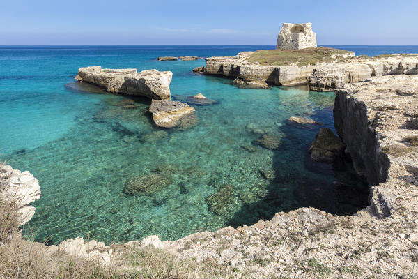 View of a sunset at the Grotta della Poesia cave in Roca Vecchia, near Torre dell'Orso. Melendugno, province of Lecce, Salento, Apulia, Italy.