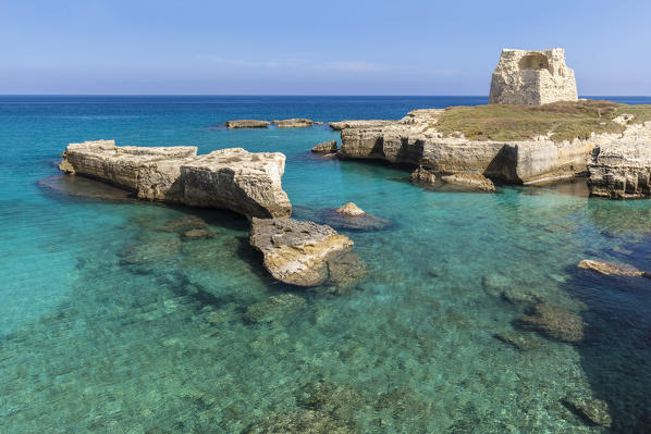 View of a sunset at the Grotta della Poesia cave in Roca Vecchia, near Torre dell'Orso. Melendugno, province of Lecce, Salento, Apulia, Italy.