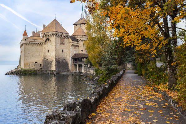 View of the Chillon castle and it's lake front in autumn. Veytaux, Montreux, Canton of Vaud, Switzerland.