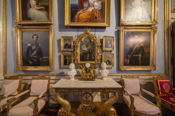 Baroque furniture and portrait paintings of nobility in the apartment rooms of Royal Palace, Stockholm, Sweden