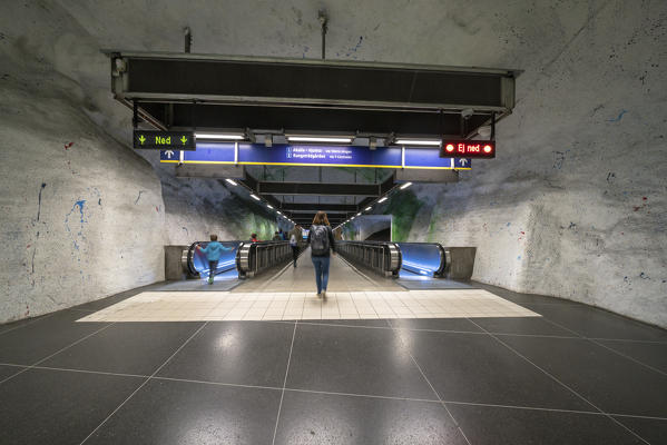 People on the escalators of Kungstradgarden Metro station, Stockholm, Sweden