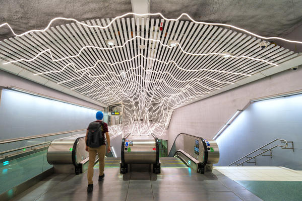 Man at the escalators in Odenplan metro station, Stockholm, Sweden (MR)