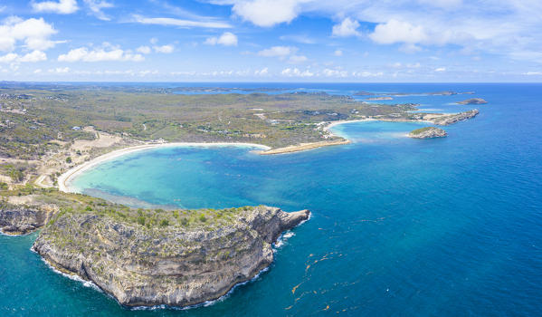 Aerial panoramic of cliffs surrounding Half Moon Bay and Exchange Bay, Antigua, Caribbean, West Indies