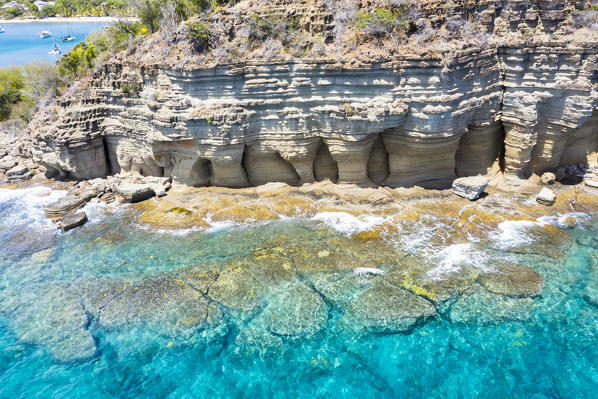 White limestone cliffs Pillar of Hercules washed by Caribbean Sea, aerial view, English Harbour, Antigua, West Indies