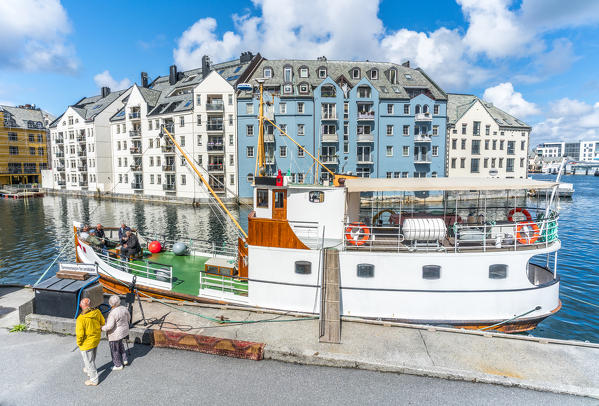 People walking on Brosundet canal waterfront, Alesund, More og Romsdal county, Norway