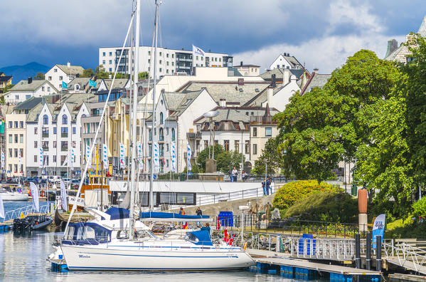 Sailboats moored in the harbour along Brosundet Canal, Alesund, More og Romsdal county, Norway