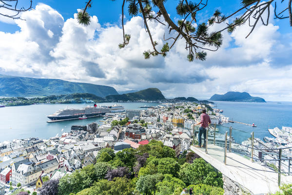 Man admiring Alesund and ocean from platform at Byrampen viewpoint, Aksla, More og Romsdal county, Norway