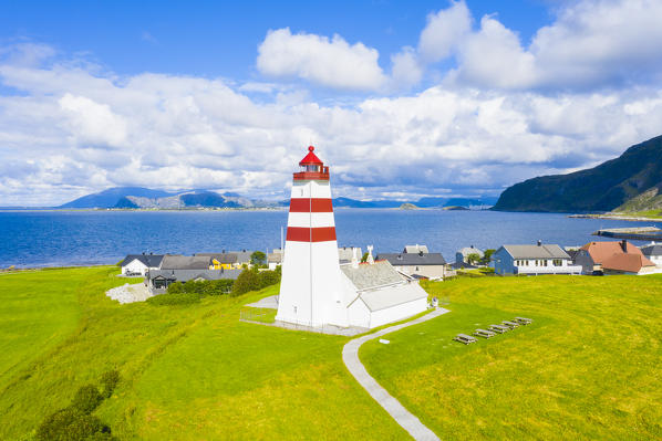Aerial view of Alnes Lighthouse between meadows and sea, Godoya Island, Alesund, More og Romsdal County, Norway