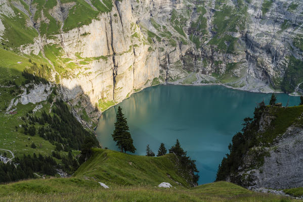 Sunset over the alpine Oeschinensee lake, Bernese Oberland, Kandersteg, Canton of Bern, Switzerland