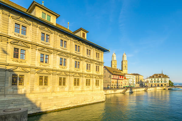 Sunset over Grossmunster Cathedral and Limmatquai street along the banks of Limmat River, Zurich, Switzerland
