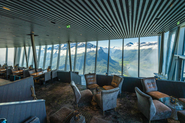 Nordfjord and mountains through glass windows of room cafe inside Hoven Restaurant, Loen, Stryn, Sogn og Fjordane county, Norway