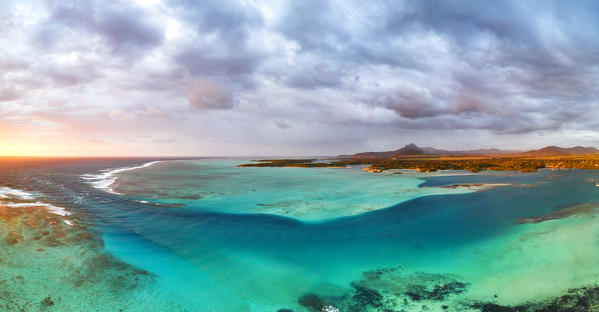 Aerial panoramic of turquoise lagoon and Ile aux Cerfs island, Trou d'Eau Douce, Flacq district, Indian Ocean, East coast, Mauritius