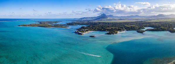 Aerial panoramic of turquoise lagoon and vegetation along coastline, Trou d'Eau Douce, Flacq, Indian Ocean, East coast, Mauritius