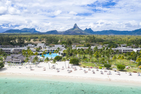 Resort on Flic en Flac beach with Piton de la Petite Riviere Noire mountain in background, aerial view, Black River, Mauritius
