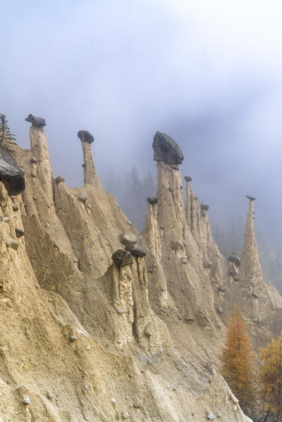Foggy sky on the Earth Pyramids natural monument, Perca/Percha, province of Bolzano, South Tyrol, Italy