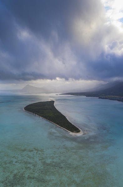 Storm clouds over lle aux Benitiers island and tropical lagoon, aerial view, La Gaulette, Le Morne, Indian Ocean, Mauritius