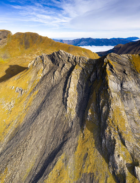 Aerial panoramic of rock face of the high mountains in autumn, First, Grindelwald, Canton of Bern, Switzerland