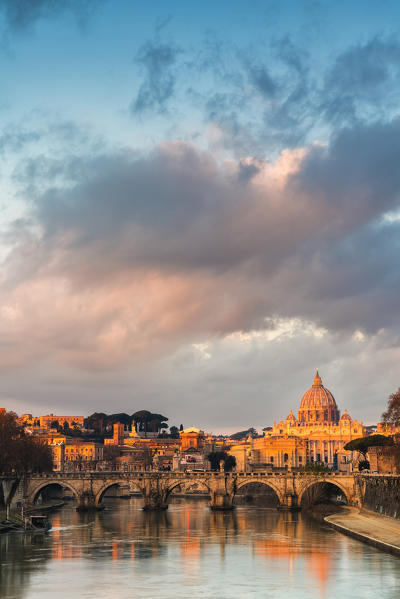 River Tiber and St. Peter's Basilica (Basilica di San Pietro) at sunrise, Rome, Lazio, Italy