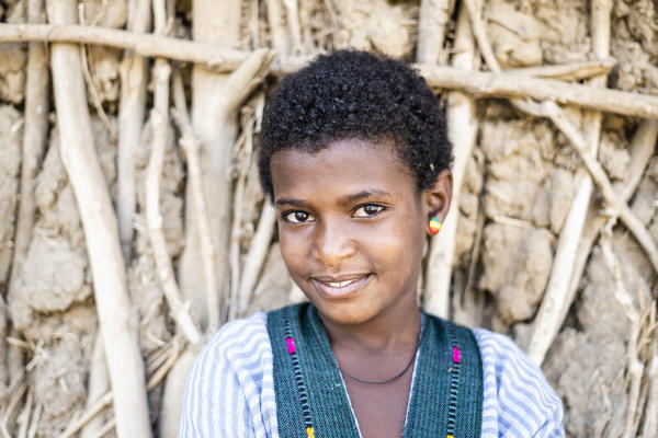 Portrait of beauty ethiopian girl smiling at camera, Abala, Afar Region, Ethiopia, Africa