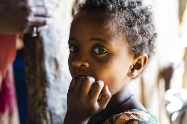 Portrait of little baby girl looking at camera, Abala village, Afar Region, Ethiopia, Africa