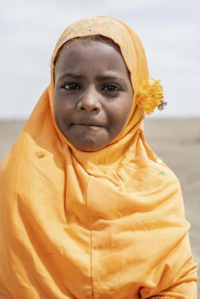 Portrait of cute little girl wearing the muslim traditional hijab, Asaita, Afar Region, Ethiopia, Africa
