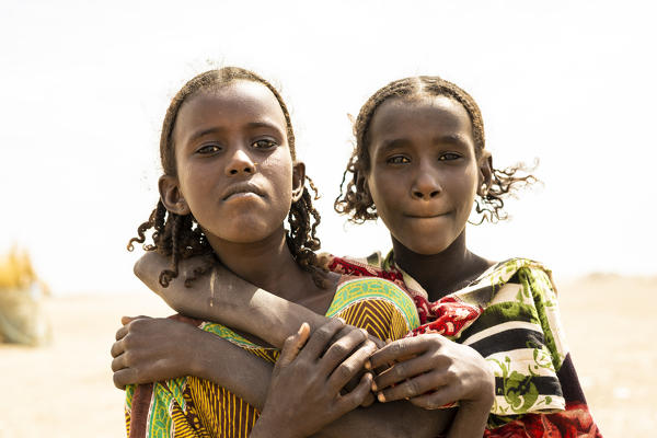 Portrait of young sisters girls with braids, Asaita, Afar Region, Ethiopia, Africa