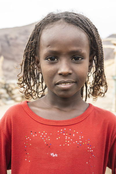 Portrait of cute little girl with braids, Melabday, Asso Bhole, Dallol, Danakil Depression, Afar Region, Ethiopia, Africa