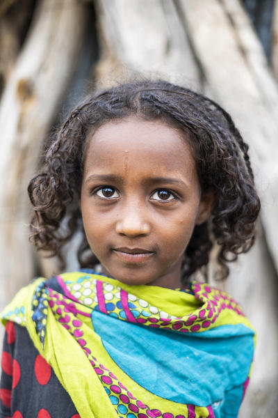 Cute little girl with traditional clothes, Melabday, Asso Bhole, Danakil Depression, Afar Region, Ethiopia, Africa