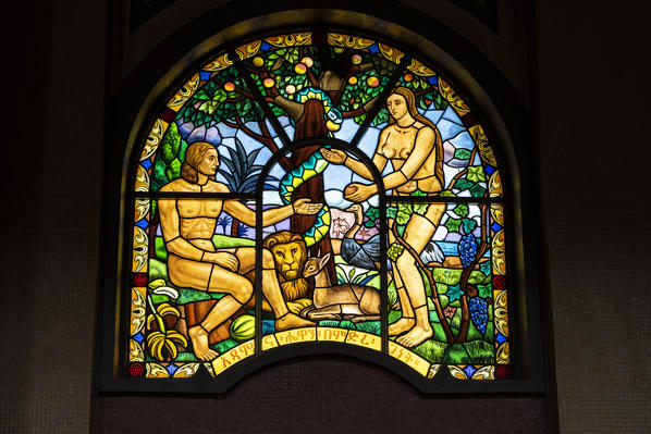 Representations of Adam and Eve on stained glass windows inside Holy Trinity Cathedral, Addis Ababa, Ethiopia, Africa