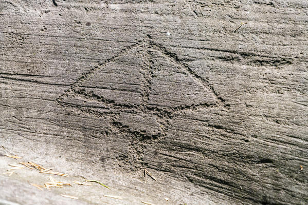 Rock engraving of prehistoric building or Camunian symbol, Naquane National Park, Capo di Ponte, Valcamonica, Lombardy, Italy