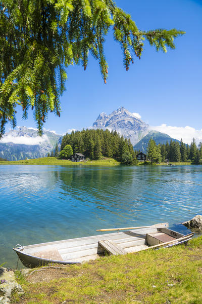 Rowboat moored on the shore of the alpine Lake Arnisee, Canton Uri, Switzerland