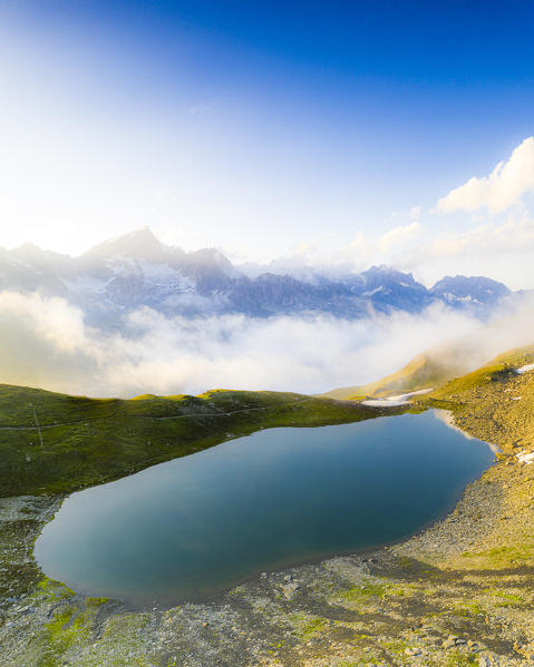 Clear water of the alpine Schwarziseeli lake at sunrise, Furka Pass, Canton Uri, Switzerland