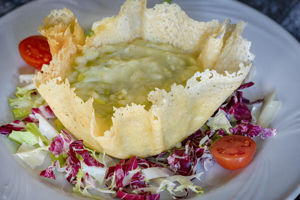 Taroz of Valtellina made with mashed potatoes, green beans, butter and Casera cheese, Sondrio province, Lombardy, Italy
