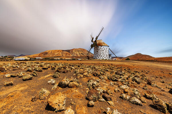 The old windmill Molinos de Villaverde in the volcanic landscape, La Oliva, Fuerteventura, Canary Islands, Spain