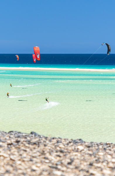 People having fun with kiteboard in the rough sea, Sotavento beach, Jandia, Fuerteventura, Canary Islands, Spain