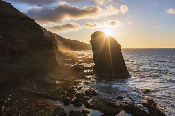 Roque Del Moro rock formation lit by sunset, Cofete beach, Jandia peninsula, Fuerteventura, Canary Islands, Spain